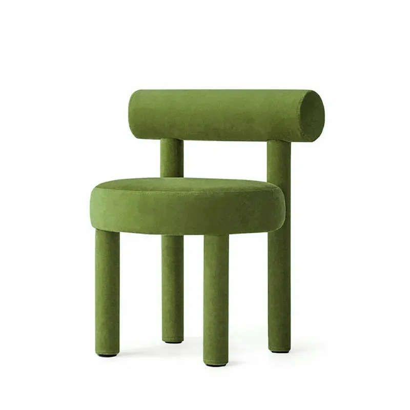 Gropius Upholstered Dining Chair: A geometric green velvet chair with a round seat, four cylindrical legs, and a bolster backrest.