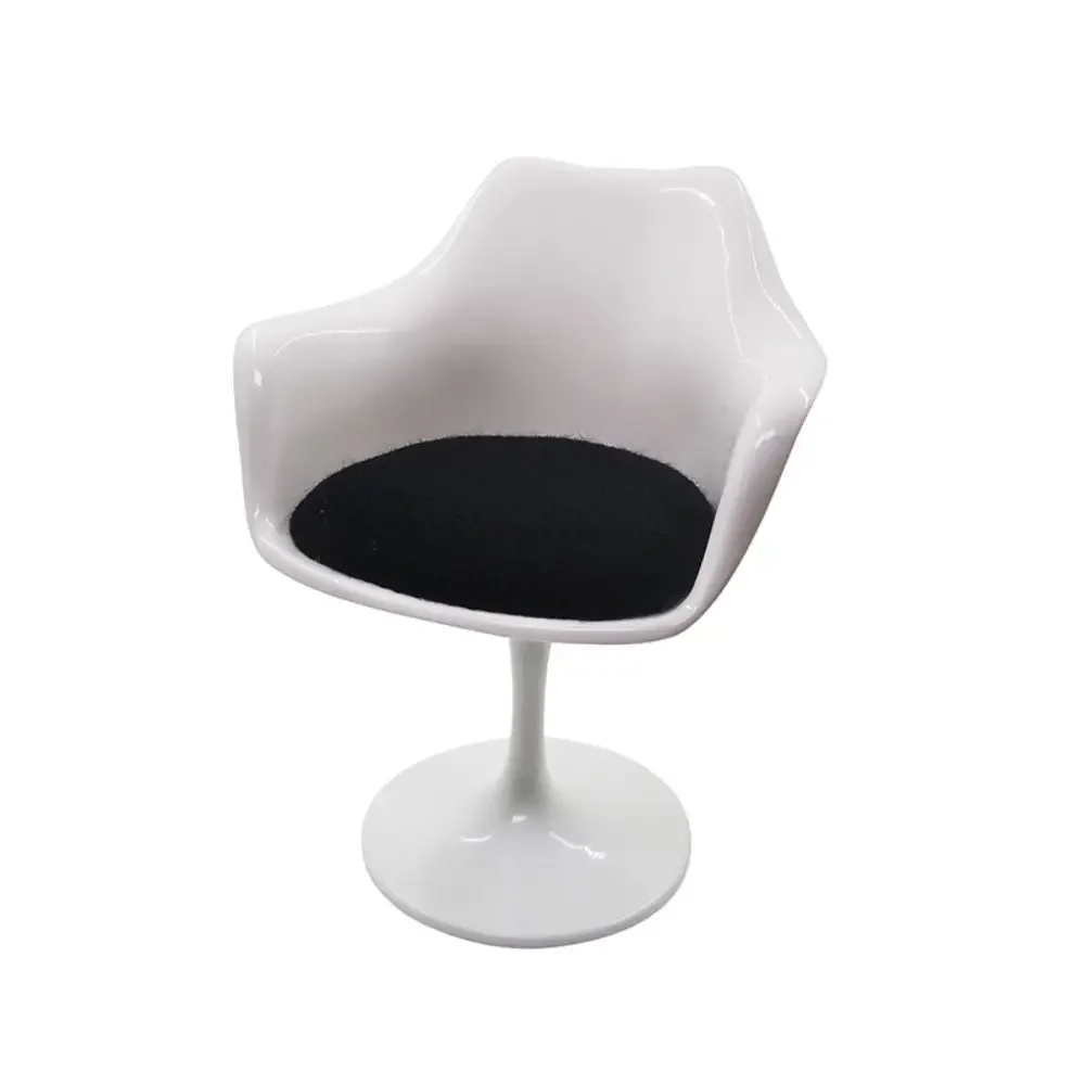 Tulip Armchair with glossy white molded shell, black seat cushion, and pedestal base in a modern minimalist design on a white background