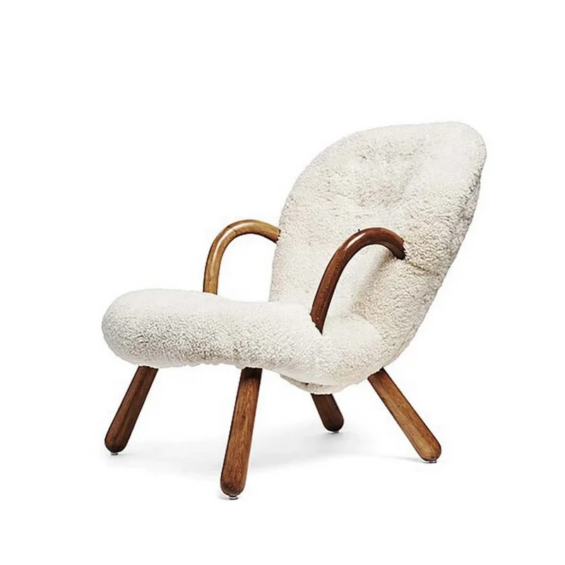 Mid-century Clam Chairs Designer Accent Chair featuring plush white sheepskin upholstery and elegant curved wooden armrests.