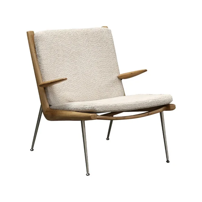 Boomerang Lounge Chair: Mid-century modern armchair with textured white upholstery, wooden wing arms, and tapered metal legs.