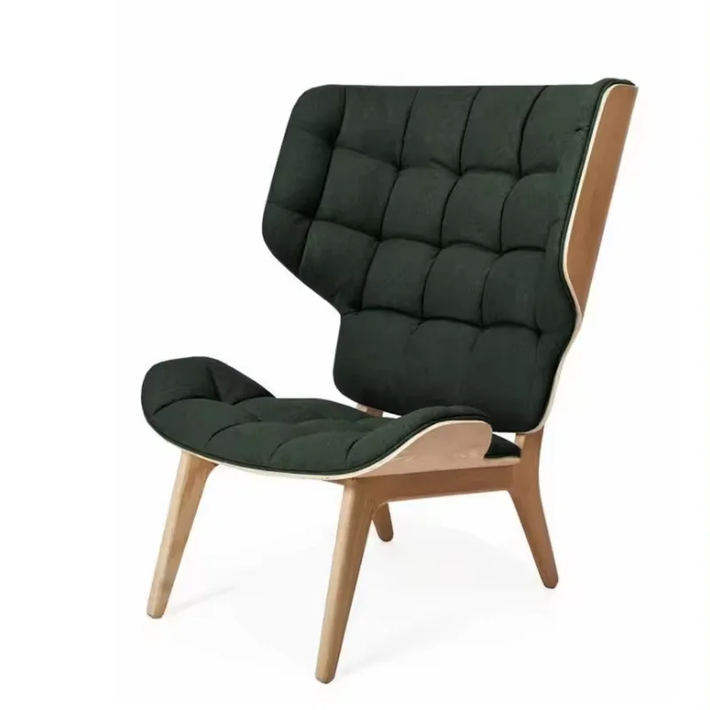 A Scandinavian-style Mammoth Lounge Chair with a dark tufted seat and high wingback profile on a light natural wood frame.