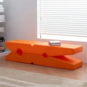 Colorful Clothespin Design Bench in bright orange, featuring a playful oversized clip shape in a modern indoor setting.
