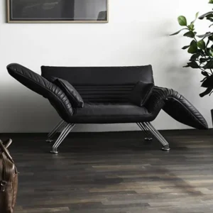 Chaise Sofa Lounge Slipper Chair in black leather with curved armrests and metal legs in a modern living room setting.