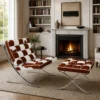 Cow Barcelona Relax Lounge Chair with matching ottoman in a brown and white cowhide pattern by a cozy fireplace.