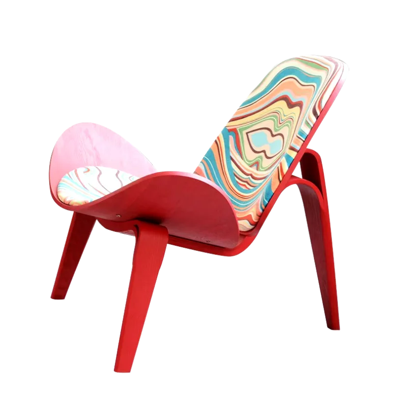 Art Shell Lounge Chair with vibrant abstract patterned upholstery, curved shell design, and bold red frame for artistic modern interiors