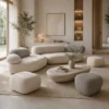 10-25096 Minimalist living room with cream and taupe rounded sofas, potted plants, and a beige rug creating a calm, neutral retreat.