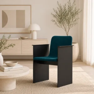 Teal upholstered lounge chair with black metal sides in a minimalist living room with neutral decor.