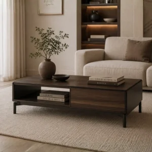 Dark wood coffee table with an open shelf, a vase with leafy branches, a small bowl, and stacked books in a beige living room.