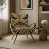 Armchair with bold black-and-tan geometric pattern in a calm living room, beside a round brass table and neutral décor.