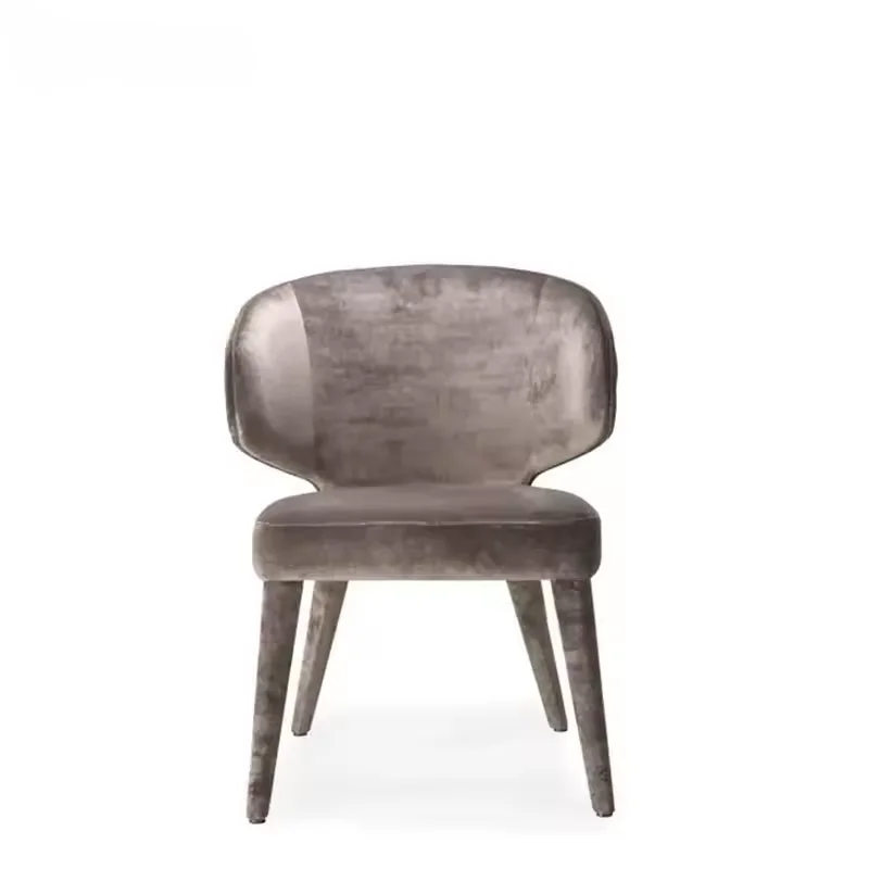 Gray velvet upholstered chair with a rounded back and tapered legs, shown from the front