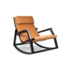 Orange leather lounge chair with a black curved rocking frame