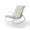 White tufted lounge chair with chrome curved legs on a white background.
