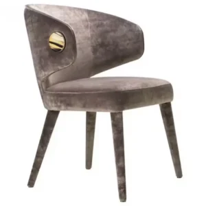 Gray velvet chair with a curved back and four angled legs, seen from the side.
