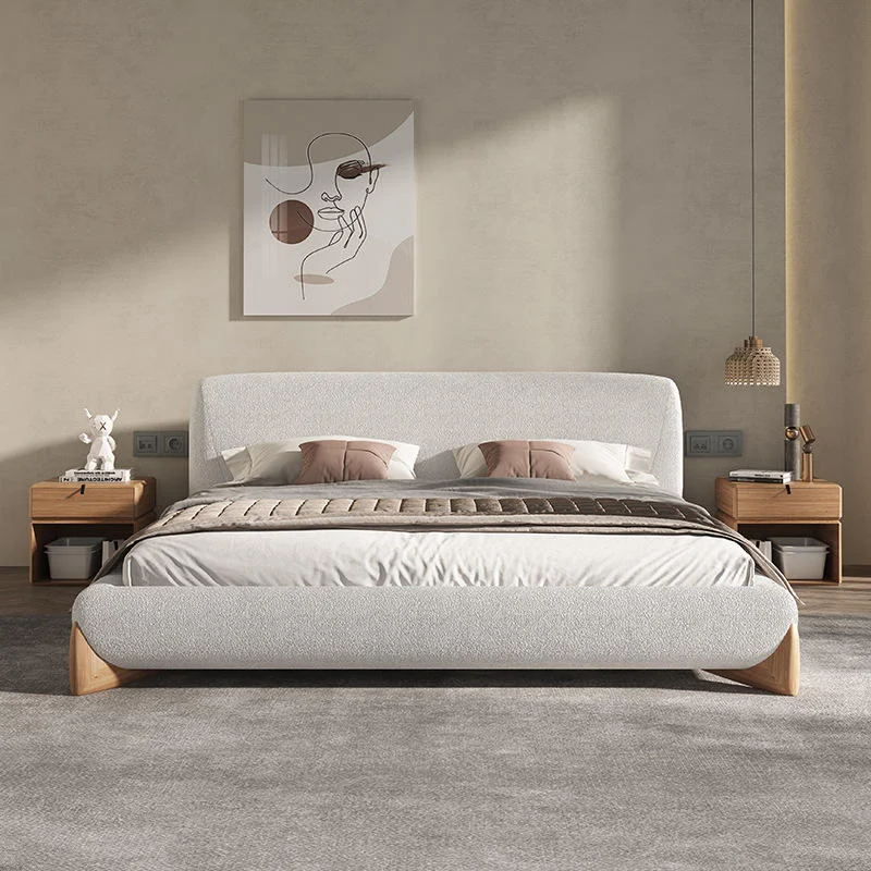 4-96458 Modern bedroom with a low, upholstered bed and matching headboard, two wooden nightstands, and neutral decor.