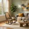 Cozy living room with a wooden rocking chair, gray sofa, mustard pillow, cream throw, and a round coffee table.