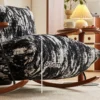 Rocking chair with thick black-and-white textured cushion in a cozy living room; a dashed vertical line and '43 cm' show the cushion height.