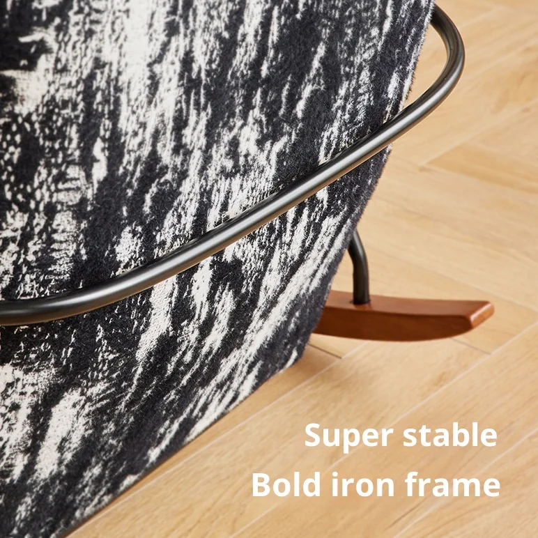 Close-up of a chair showing a bold iron frame and patterned upholstery on a wooden floor, with the caption 'Super stable'.